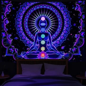 Chakra Black Light Tapestry glowing vibrantly under a UV light | Ravers Co