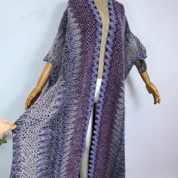 Trippy Crochet Poncho Cloak in Gold Blue Teal on a model | Ravers Co