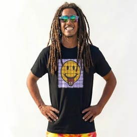 A mid shot photo of Mana proudly wearing the smiley square t-shirt