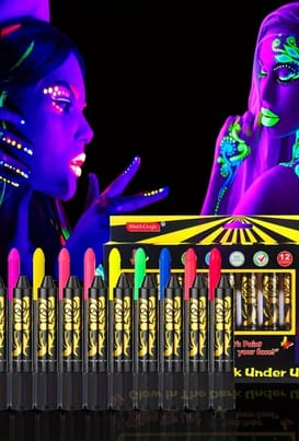 A pisture of a set of uv neon make-up pens and two models with face painted