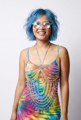 A photo of Sue wearing the Rainbow coloured Candy Bead Jewell Top