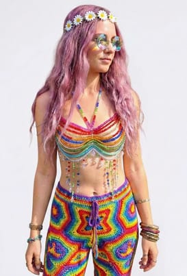 A photo of Laura wearing the Rainbow Bead Chain Top and other trippy festival clothing.