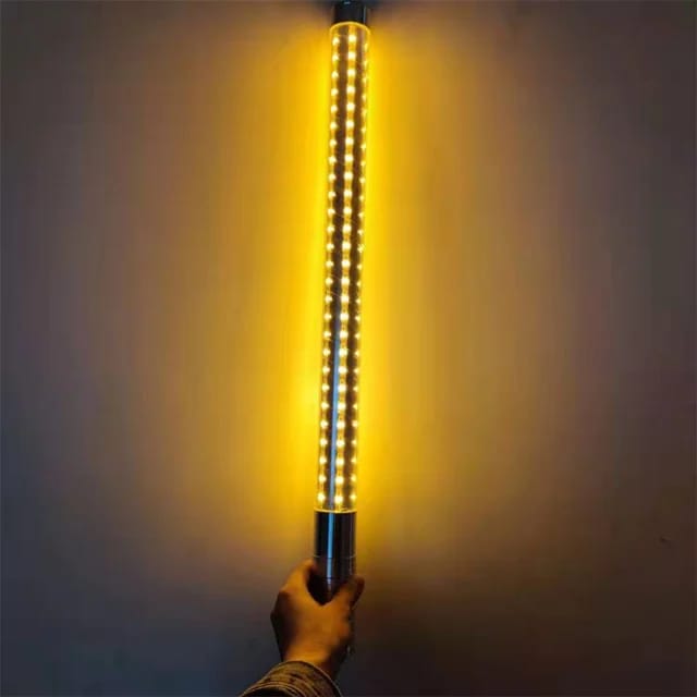 Pink LED Strobe Baton held by a raver at night | Ravers Co