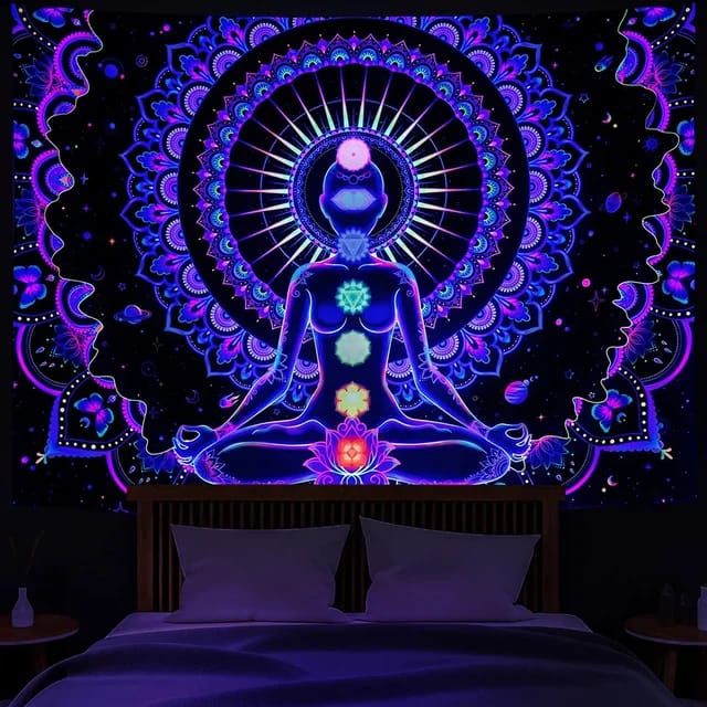 Chakra Black Light Tapestry glowing vibrantly under a UV light | Ravers Co