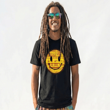 A photo of Mana happily wearing the Happy Acid 303 T-Shirt