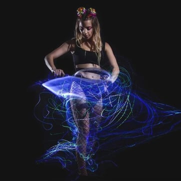 Programmable LED Fibre Optic Whip in action at a festival | Ravers Co