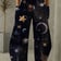 Galaxy Wide Leg Pants with cosmic star print - front view | Ravers Co