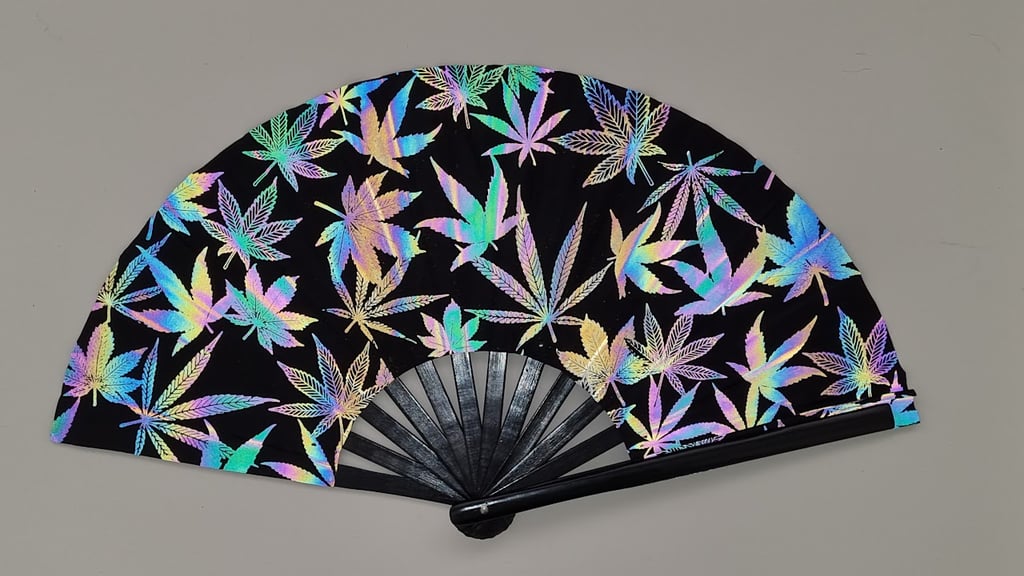 Leafy Breeze Hand Fan - glowing iridescent leaf print under flashing festival lights | Ravers Co