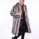 Jospeh wears the Silver Fox Faux Fur Coat with Black Sequin Pants, A Mesh Rave Top And Personalized Part Boots