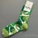 Men's Green Colourful Happy Socks laid flat showing thick cotton texture and high tube design | Ravers Co