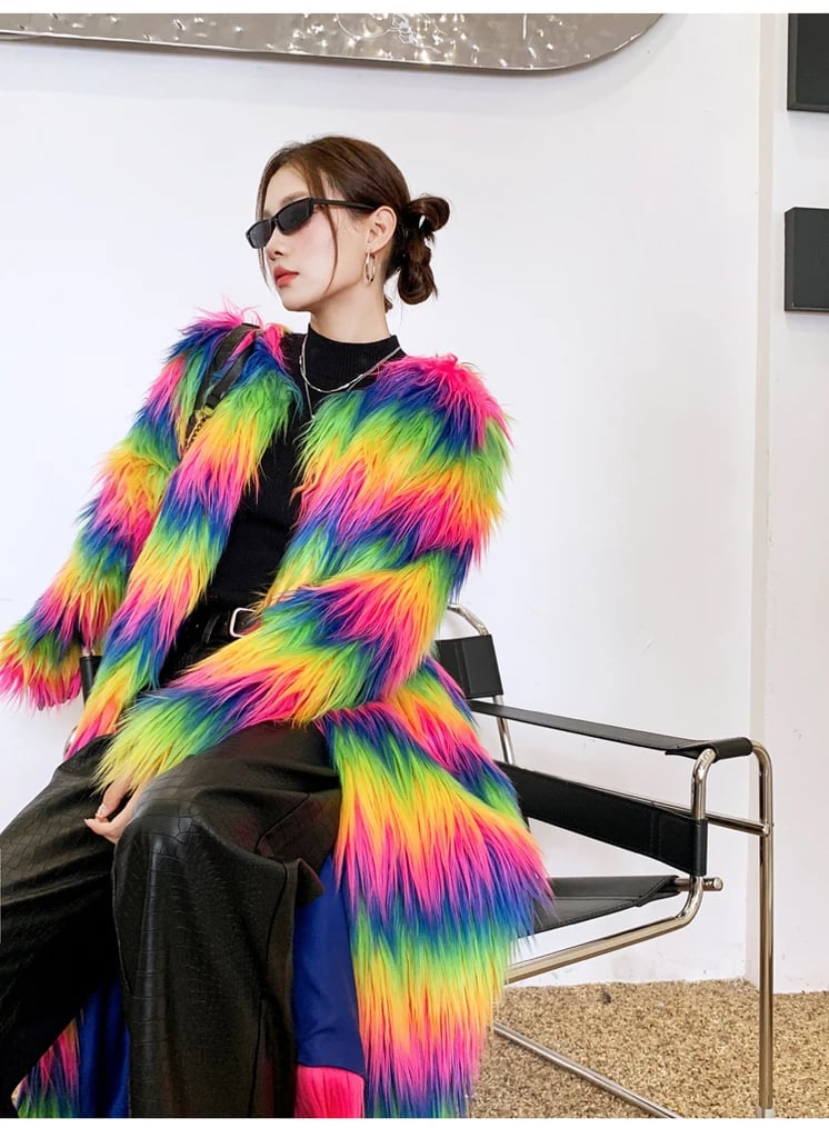 Model dancing in the Neon Rainbow Furry Coat at an outdoor rave | Ravers Co