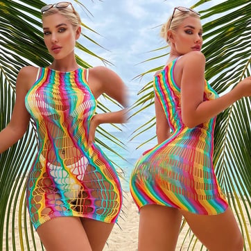 Model wearing the Rainbow Stripe Mesh Dress as a festival swimwear cover-up | Ravers Co