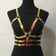 Golden Rainbow PVC Harness on model front view | Ravers Co
