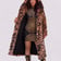Sue is wearing the Wildcat Faux Fur Coat facing the camera