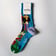 Colourful Happy Socks for men showing vibrant festival pattern laid flat | Ravers Co