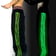 Man wearing Glow Stripe Rave Pants from a side angle at a festival | Ravers Co