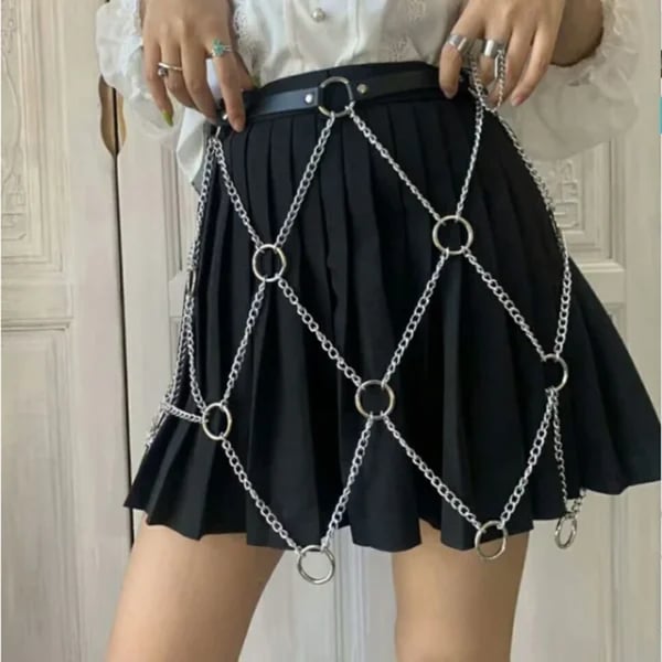 A photo of Sam wearing the diamond chain leather skirt.